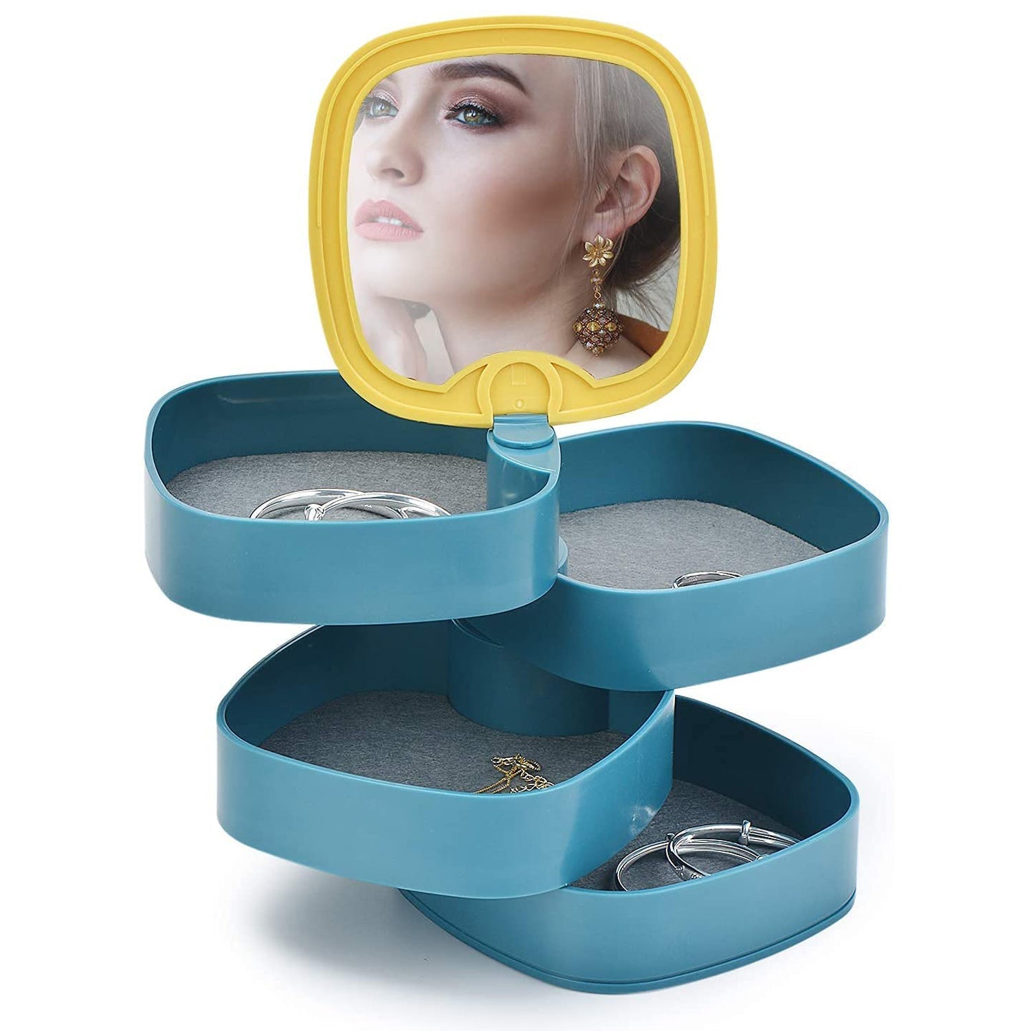 Jewelry box with open layers showing storage compartments Jewelry box with open layers showing storage compartments